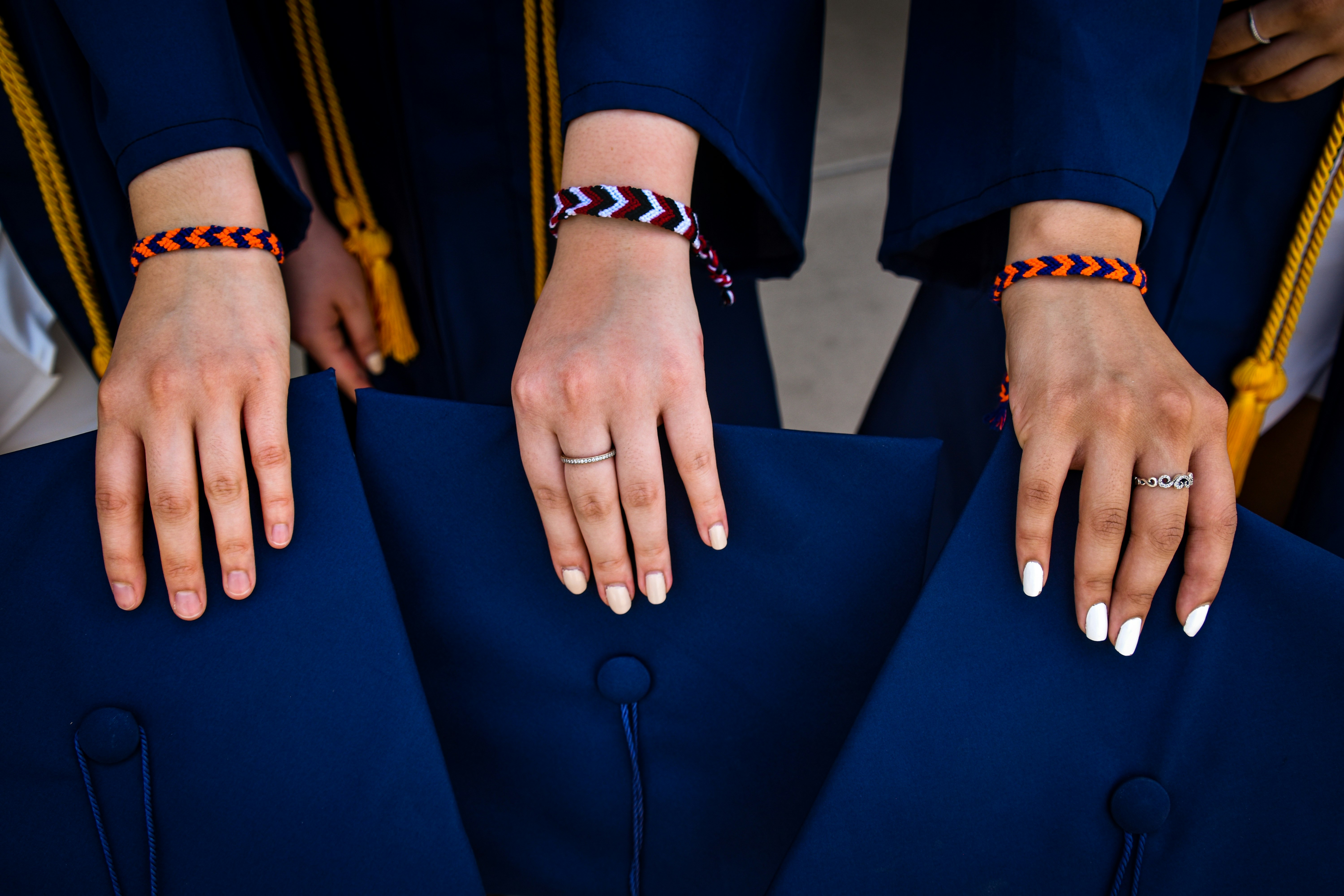 person wearing silver ring and bracelet